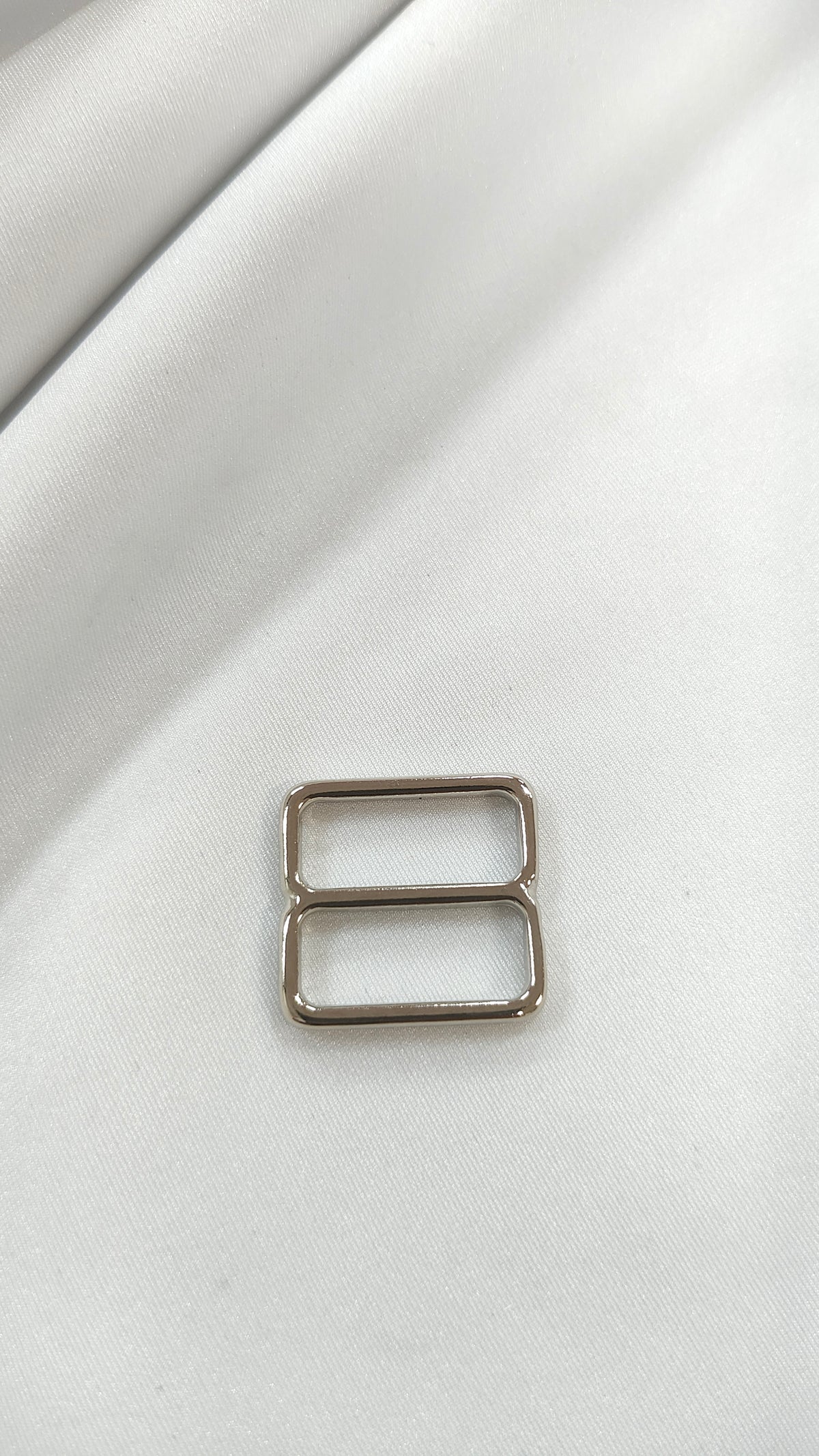 Ajustador plateado17mm (por docena)