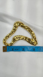 Adorno metalico asimetrico dorado