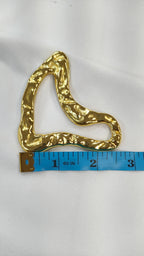 Adorno metalico asimetrico dorado