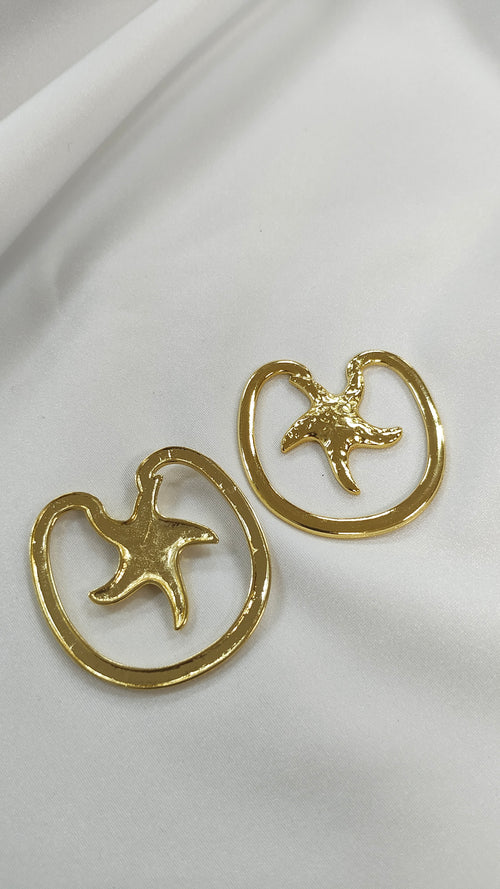 Adorno metalico estrella de mar dorado