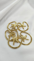 Adorno metalico estrella de mar dorado