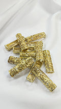 Pasador metalico floral dorado