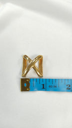Pasador metalico en X dorado