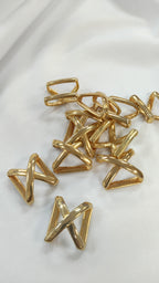 Pasador metalico en X dorado