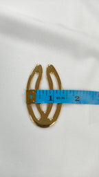 Adorno metalico ovalo dorado