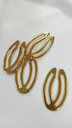 Adorno metalico ovalo dorado