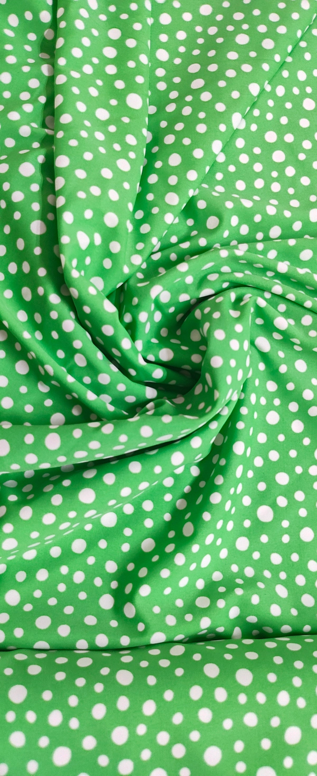 Polka dots green base