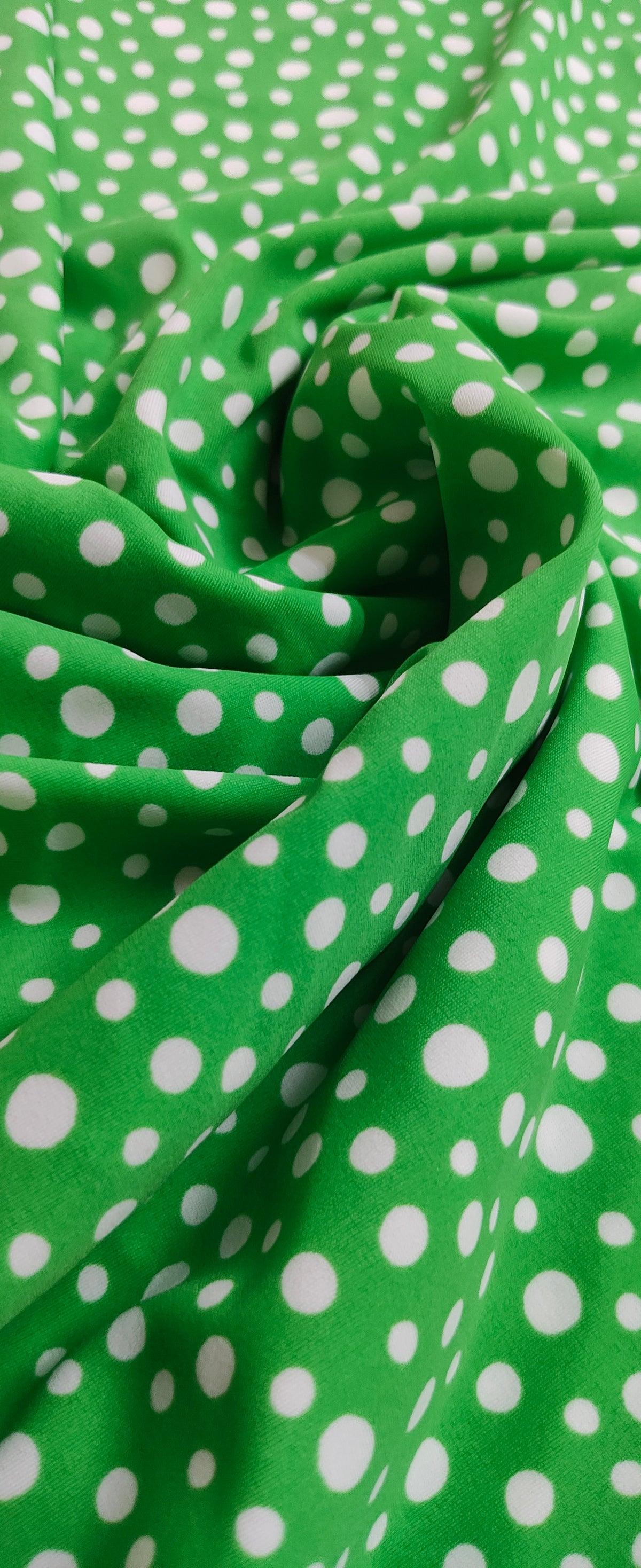Polka dots green base