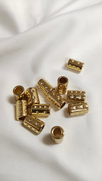 Tapa nudo dorado cilindro (docena)