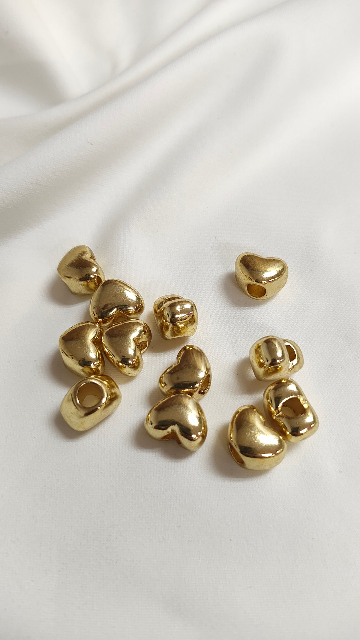 Tapa nudo dorado de corazon (docena)