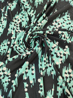 Jersey estampado negro y verde menta